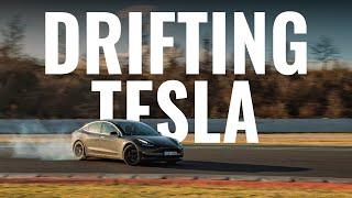 Tesla with KW suspension drifting on a racetrack