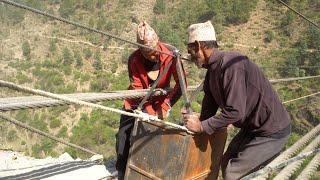 dharme brother working with villagers , building a river bridge in the village || rural Nepal ||