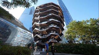 Tourists return to NYC's Vessel sculpture as it reopens with safety netting to prevent deaths