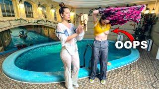 Two girlfriends bathing and wetlook fun in the pool try on clothes