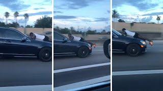 Man Caught Clinging Onto Car Bonnet Down Highway