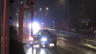 Hamilton Police cruiser 783-2 escorting ambulance in heavy rainfall