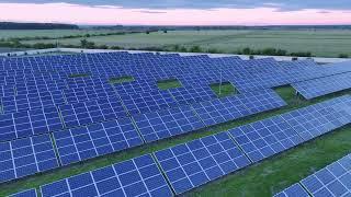 Solar panels and solar power fields drone video 8k