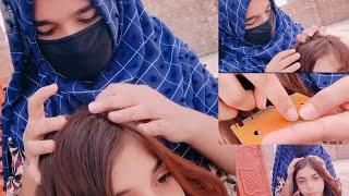 Little village girl short beautiful hair checking by Noor another part