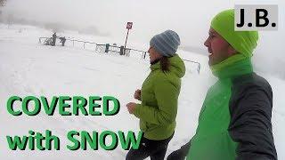 Under snowfall running in Moscow Brateevo