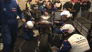 Look at this teamwork! BMW rebuilding their bike after a crash