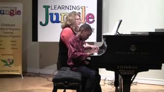 Kareem and Olga (Teacher) performing "Copy Cat" a duet