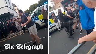 Moment police dog bites rioter shouting 'I pay your wages'