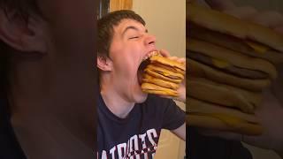 Isaac, the man with the world's biggest mouth, can eat four burgers at once 