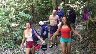 The girls get wet sliding down Imbert Waterfalls.