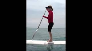 Delray Beach Fl paddle boarding wearing Ocean Living USA sun protective swimwear