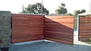 Trackless bi fold automatic gate 14'