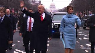 Trumps walk down Pennsylvania Avenue during parade