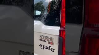 taking delivery MahindraScorpio classic white colour