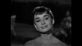 The chauffeur's daughter arrives at the party -- Audrey Hepburn as Sabrina