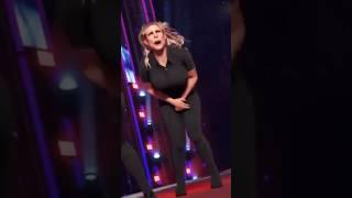 Beth Phoenix receiving a low blow from a knee!