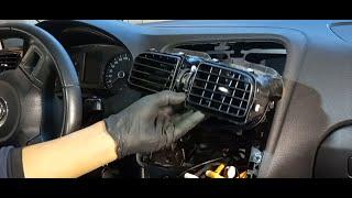 Removing the radio and the  dashboard center air vent grille VW Polo