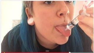 Cleaning a Tongue Piercing With a Syringe