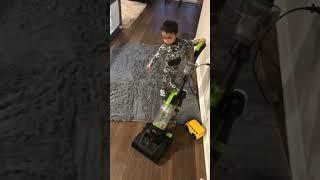 Johan vacuuming living room - 1 Toddler vacuum
