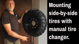 How to mount side-by-side tires with a manual tire changer.