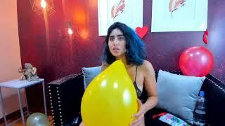 Cute camgirl blowing balloons