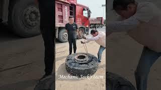 Lady Mechanic Change Truck Tire at Outdoor