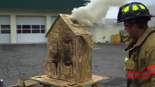 Salem firefighter demonstrates fire flow paths by burning down doll house