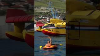 Canadair CL-415 Pilot Waving at Public while Scooping Water