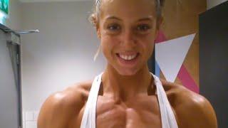 Beautiful muscular woman flexing muscles