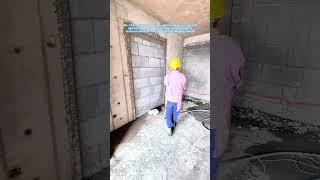 Construction Worker Spraying Cement Mortar with Shotcrete Machine