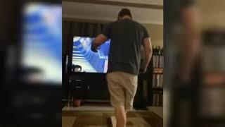 guy jumps into TV while using VR goggles