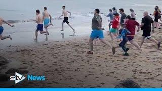 Hundreds of Scots brave the cold for Loony Dook dips