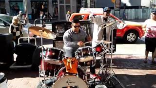 Serg playing the drums on Market st. in San Francisco California