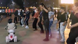 JIAN GE AND HIS FAMILY DANCING IN PARK 2023