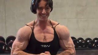 Beautiful muscular woman flexing muscles