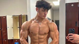 20 years old teen boy flexing muscle