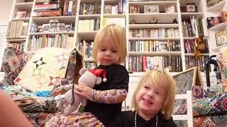 Twins read Snowy's Magical Christmas Eve