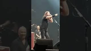 A kid plays Metallica at a concert