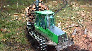 John Deere 1110D logging in wet forest, big load, difficult conditions