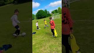 U6 centre back showing a very mature approach to timing a tackle with precision and strength.