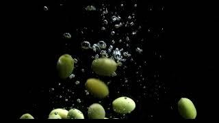 Free Footage: Olives fall into the water with air bubbles