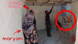 Welding of roof irons of nomadic orphanage with the help of neighbors and Professor Mehrdad