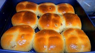 Soft fluffy cinnamon hot cross cinnamon buns with dried golden brown Raisins