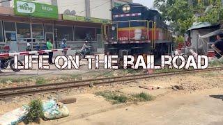 Life on the railways shows the real activities of daily life in Phnom Penh, Cambodia.