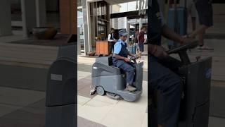 A woman operating an automatic floor mopping machine #auto_flor_clening_machine #shorts #kolhapur