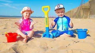 Gaby and Alex playing on the Beach with Sand and other Kids Toys