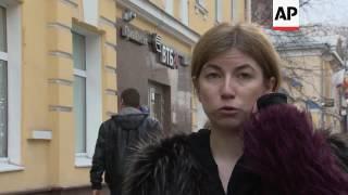 Raids on homes of Kremlin foe's employees