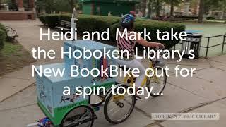 Hoboken Library's New BookBike , is out for a spin today with Heidi and Mark.