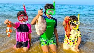 Children fishing for fish on the beach -ADEL ET SAMI