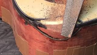 Shaping a scoop cutaway with a rasp before veneering Beau Hannam guitars ukuleles